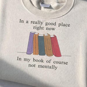 May include: A set of three ceramic mugs with a speckled, matte finish. The mugs are in shades of cream, light gray, and dark gray. Each mug has a simple, modern design and a rounded handle.