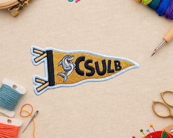 Parche bordado termoadhesivo y para coser con la bandera de la Universidad Estatal de California, Long Beach - Mascota del tiburón, parche universitario dorado y negro