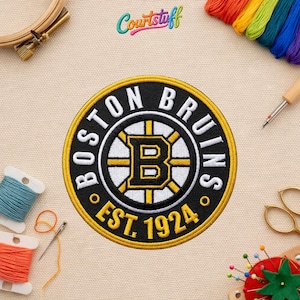 May include: Embroidered Boston Bruins patch with a black, gold, and white color scheme. The patch features the team logo, the words "BOSTON BRUINS" and "EST. 1924". The patch is round and has a detailed design.