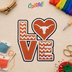 May include: A white ceramic mug with a black handle and the text "But First, Coffee" in a bold, black font. The mug is set against a neutral background, highlighting its simple design.