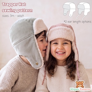 May include: A trapper hat sewing pattern featuring text that reads Trapper Hat sewing pattern, sizes: 3m - adult, and *2 ear length options. The image displays two hats with white faux fur lining, one in sage green corduroy and one in dusty pink.