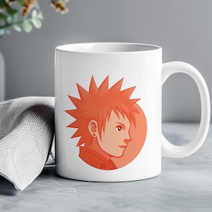 May include: White ceramic mug with an orange illustration of a character with spiky hair and a circular background. The design is on the front of the mug, with a curved handle.