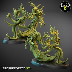 May include: Two green, stylized fantasy figures with tentacle-like features and flowing forms. The figures are on black bases, with the text "PRESUPPORTED STL" at the bottom. A logo is in the upper right corner.