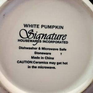 May include: White Pumpkin Signature Housewares Incorporated stoneware mug. Dishwasher and microwave safe. Made in China. Caution: Ceramics may get hot in the microwave.