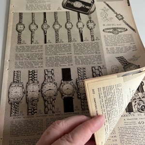 May include: A vintage catalogue page showcasing a range of Buren wristwatches. The watches are presented in rows with their prices and model numbers listed beneath. The catalogue page also includes a description of the watches and their features.