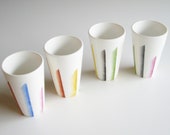 Ceramic shot glasses made by Sam and Squitto, hand painted with colorful stripes, good  for coffee, smoothie or long shots