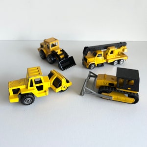 Majorette Die Cast Lot, 4 Toy Vehicles, 283, 263, 287, 226 Bulldozer, Steam Roller, Crane, Shovel Nose Tractor, Yellow & Black, 1990s