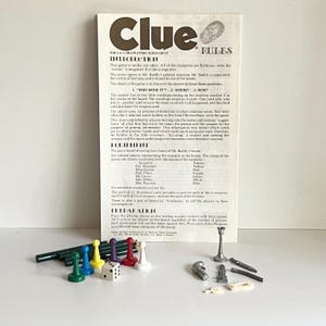 May include: A vintage Clue board game set with the game board, playing pieces, weapons, and a die. The game board features a mansion with nine rooms. The playing pieces are colored tokens representing the suspects in the game. The weapons are miniature versions of the weapons used in the game.