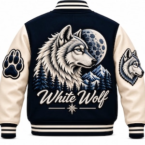 May include: A navy blue varsity jacket with cream-coloured sleeves, featuring a large graphic on the back of a white wolf, a full moon, and pine trees. The text "White Wolf" is printed below the graphic, with a paw print and wolf head on the sleeves.