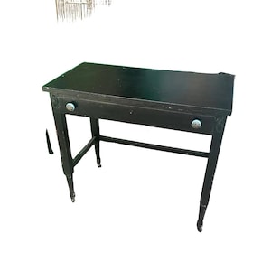Simple Black Vintage Desk on Wheels With Turquoise and Silver Knobs