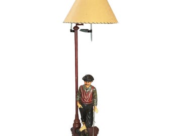Lampada da terra MCM in legno a forma di golfista.