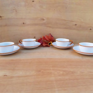 Vintage enamelware cups and saucers - white and orange enamelware - coffee cups and saucers - graniteware - set of 4 - country kitchen