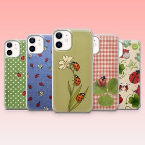 May include: A collection of five phone cases with various designs. The cases feature patterns such as polka dots, ladybugs, gingham, and floral motifs. The color palette includes green, blue, red, and white, creating a cheerful and nature-inspired aesthetic.