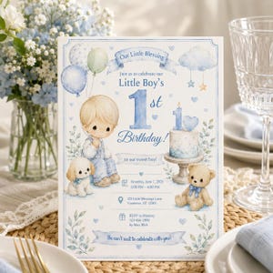 Może przedstawiać: Prostokątne zaproszenie z akwarelowymi ilustracjami małego dziecka, szczeniaka i pluszowego misia w odcieniach niebieskiego. Tekst zawiera Our Little Blessing, Little Boy's 1st Birthday, datę, godzinę, lokalizację oraz szczegóły RSVP.