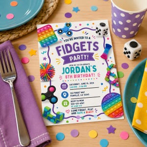 May include: A rectangular party invitation card with a white background featuring colorful illustrations of various fidget toys, including spinners, pop-its, and sensory balls. The text reads: YOU'RE INVITED TO A FIDGETS PARTY! JORDAN'S 8TH BIRTHDAY!