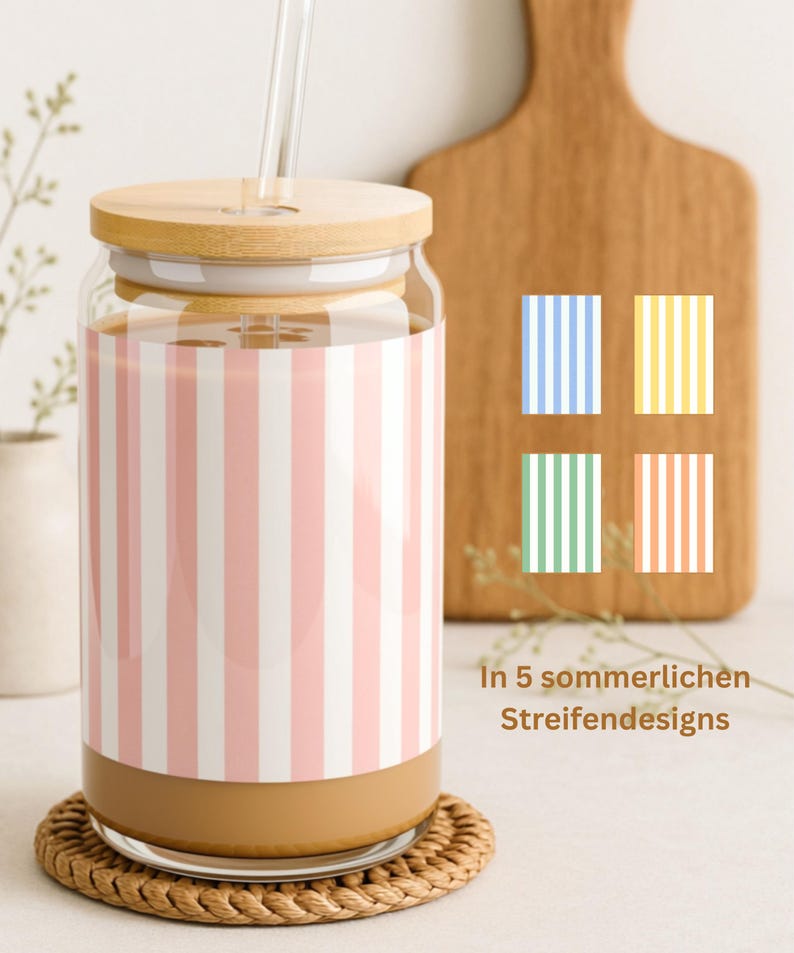 May include: A clear glass tumbler with a bamboo lid and a glass straw, featuring a pink and white vertical striped pattern. To the right, four small squares display additional blue, yellow, green, and orange striped color options.