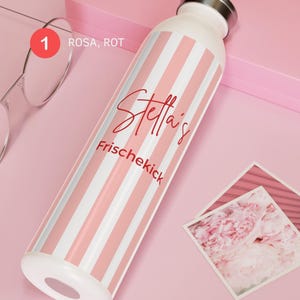 May include: A white water bottle with vertical light pink stripes, a silver-toned cap, and red text that reads "Stella's Frischekick". The bottle also features a small red circle with the number 1 and the text "ROSA, ROT" printed near the top.