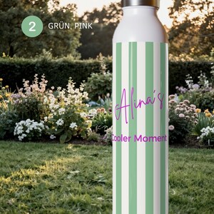 May include: A white water bottle with vertical light green stripes and a silver-colored cap. The text "Alina's" and "Cooler Moment" is printed in purple script and sans-serif font on the front of the bottle, which also features a green circle with the number 2.