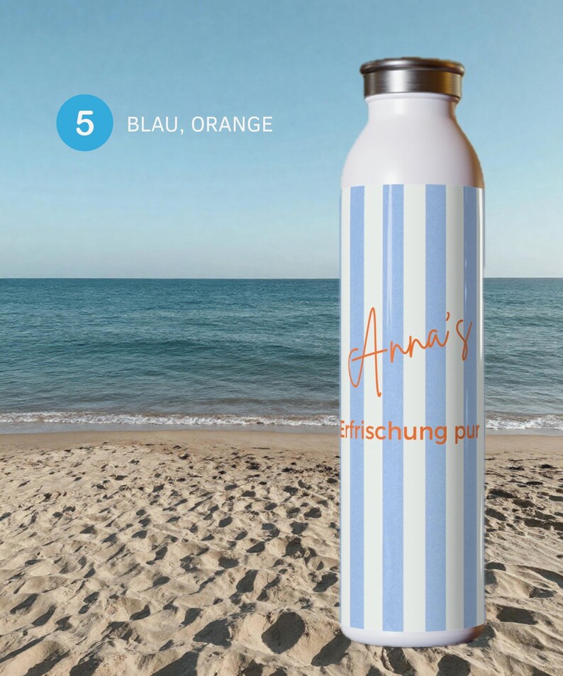 May include: A white water bottle with vertical light blue stripes. The bottle features the orange text "Anna's" in a cursive script and the orange text "Erfrischung pur" in a sans-serif font. It has a metallic silver cap at the top.