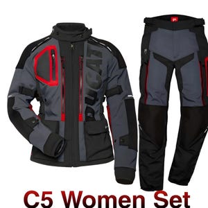 May include: A grey and black motorcycle jacket and trousers set with red detailing. The jacket features the word "DUCATI". The set includes a jacket with multiple pockets and zips, and matching trousers. The text "C5 Women Set" is at the bottom.