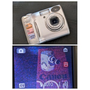 May include: Silver Nikon Coolpix 4600 digital camera with a 3x zoom lens and red-eye fix feature. The camera's screen displays a preview image. The camera has a 4.0 megapixel resolution.