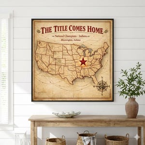May include: A framed vintage-style map of the United States, with a red star marking a location in Indiana. The text "THE TITLE COMES HOME" is at the top, with "National Champions. Indiana" and "Bloomington, Indiana" below. A compass rose is in the lower right corner.