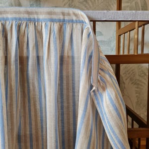 Sky blue stripe viscose linen blend cabinet curtain with adhesive hook and loop attachment, featuring a natural linen background and soft blue woven stripes.