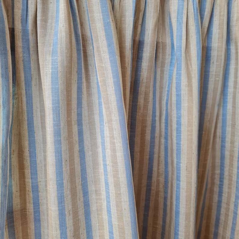 Close-up of the sky blue stripe viscose linen blend cabinet curtain showcasing the premium woven fabric, natural linen texture, fine stitching, and soft flowing drape.