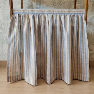 Full view of the sky blue stripe viscose linen blend cabinet curtain designed for cabinets, under sink storage, shelves, or small windows.