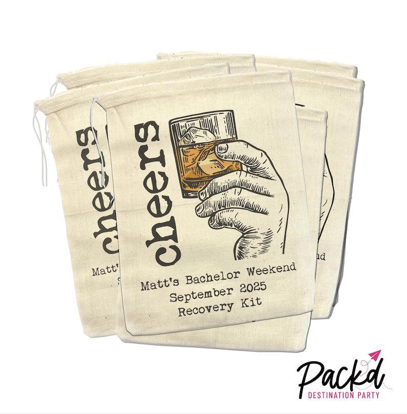 May include: Set of four beige canvas bags with a hand drawn illustration of a hand holding a glass of whiskey. The bags have the text "cheers" printed on them and the text "Matt's Bachelor Weekend September 2025 Recovery Kit".