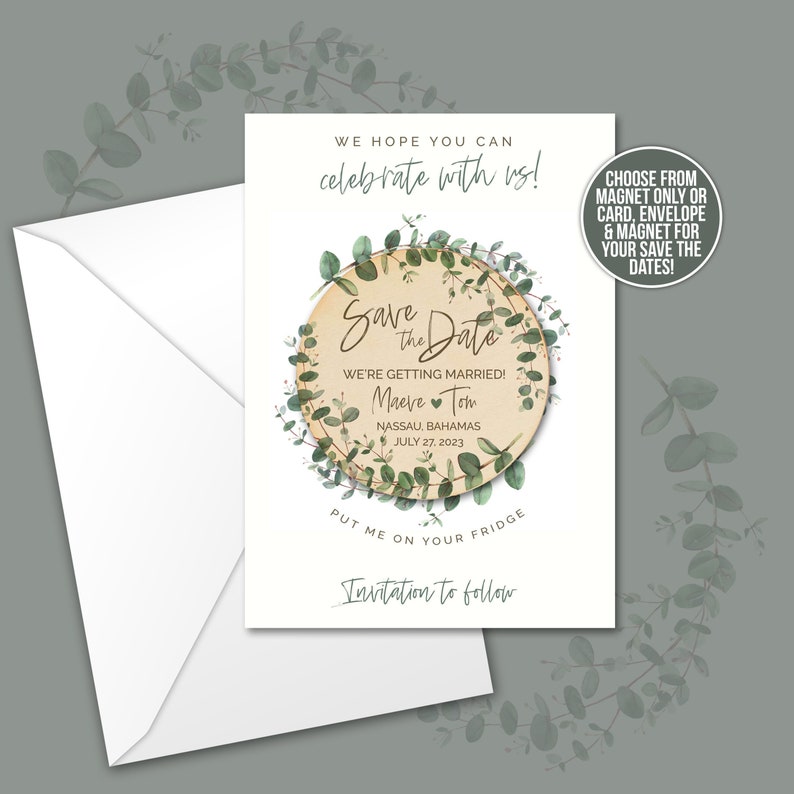 May include: Save the Date magnet with a eucalyptus wreath design. The magnet features the names Maeve and Tom, the date 27 July 2023, and the location Nassau, Bahamas. The text "We're getting married!" is also included. The magnet is on a white background.