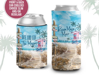 May include: Two blue and white neoprene can coolers with a beach scene and palm trees. One cooler says "We Did It! The Meugers" and the other says "Riviera Maya Mexico July 17, 2024".