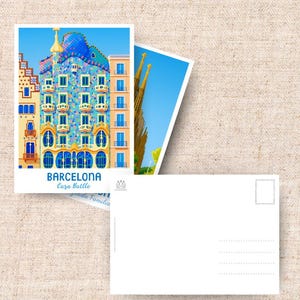May include: Two postcards featuring architectural landmarks of Barcelona. One postcard displays Casa Batll&oacute; with blue, yellow, and green details. The other shows a view of the Sagrada Familia. The postcards are white with a blank back.