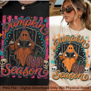 May include: A t-shirt featuring a graphic of a ghost sitting in a chair reading a book, accompanied by a black cat, a leopard-print pumpkin, skulls, and a coffee cup. The text reads Pumpkin Season in orange and pink script against a striped background.