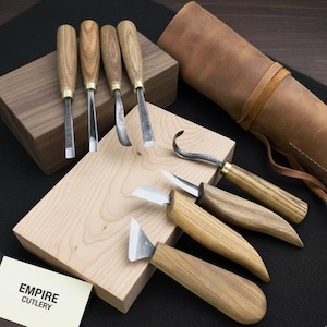 May include: A set of three ceramic mugs with a speckled, matte finish. The mugs are in shades of cream, light gray, and dark gray. Each mug has a simple, minimalist design, perfect for coffee or tea.