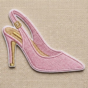May include: Embroidered pink high heel shoe patch with a gold-colored heel and interior. The shoe has a slingback strap and a white border. The patch is designed to be ironed or sewn onto fabric.