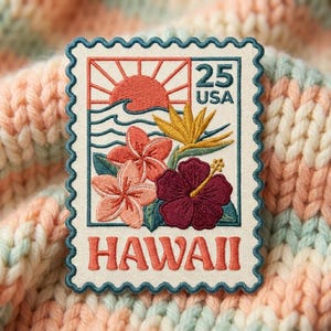 May include: A rectangular embroidered patch shaped like a postage stamp featuring a sunset over ocean waves, tropical flowers, and the text 25 USA and HAWAII. The design includes a red sun, blue waves, pink plumeria, and a dark red hibiscus.