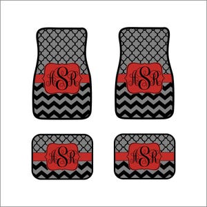 May include: Set of four black and gray car floor mats with a red chevron pattern and a red monogram "ASR" in the center.
