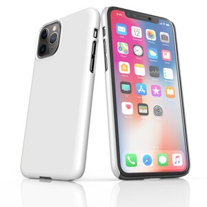 May include: A white iPhone case with a black iPhone showing the home screen with various app icons. The phone is on a white surface.