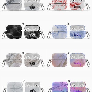 May include: Eight different Airpod cases with various marble patterns. The cases are open and show the inside of the case. Some cases have a monogram and others have the name "Lindsay" printed on them.