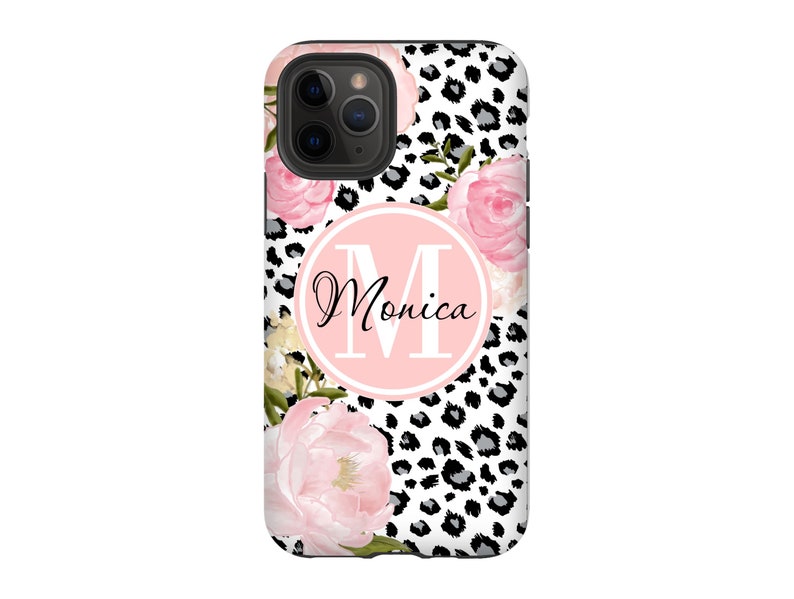 May include: A black and white leopard print phone case with pink flowers and a pink circle with the letter "M" and the name "Monica" in black text.