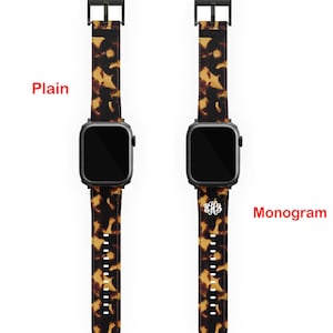 May include: Two Apple Watch bands with a tortoise shell pattern. The band on the left is plain, while the band on the right has a monogram on it. The text "Your Choice" is above the bands, and the text "Plain" is to the left of the left band, and the text "Monogram" is to the right of the right band.
