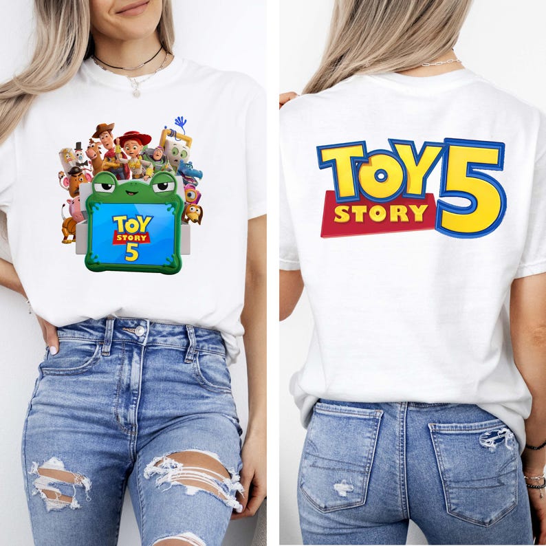 May include: A white t-shirt featuring a front graphic of Toy Story characters surrounding a green frog-shaped frame with the text Toy Story 5 inside. The back of the shirt displays the large blue and yellow text Toy Story 5 on a red background.