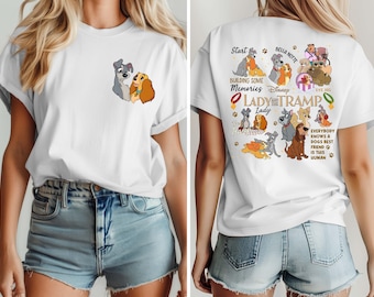 May include: White t-shirt featuring a front graphic of Lady and Tramp, and a back graphic with multiple illustrations of the dogs, and text that reads "Start Building Some Memories Disney Lady and the Tramp".