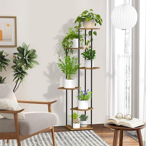 May include: A set of three ceramic mugs with a speckled, matte finish in cream, light grey, and dark grey. Each mug has a simple, minimalist design and a rounded handle.