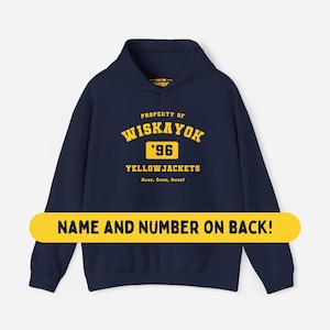 May include: A navy blue hooded sweatshirt featuring yellow text that reads PROPERTY OF WISKAYOK '96 YELLOWJACKETS Buzz, buzz, buzz! A yellow horizontal banner across the center displays the text NAME AND NUMBER ON BACK! in dark blue letters.