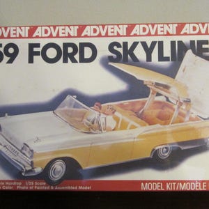 May include: '59 Ford Skyliner model kit box. The box features a white and yellow convertible car with the top open. The text "ADVENT" and "'59 FORD SKYLINER" are prominently displayed. The box also states "Retractable Hardtop 1/25 Scale".