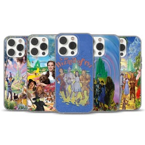 May include: A selection of phone cases with designs from "The Wizard of Oz." The cases showcase iconic scenes and characters such as Dorothy, the Tin Man, the Cowardly Lion, and the Wicked Witch, in vivid colours.