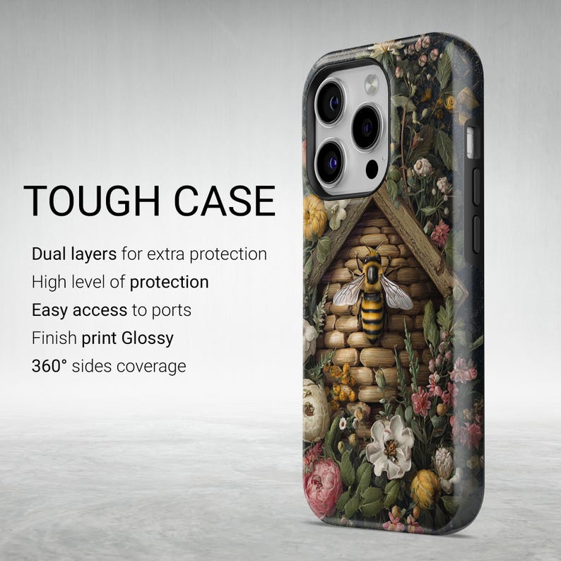 May include: A tough phone case with a floral and bee design. The case features a detailed illustration of a beehive surrounded by flowers. The text "TOUGH CASE" is displayed in bold, black letters.