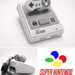 Könnte beinhalten: Eine hellgraue Super Nintendo Entertainment System Konsole mit passendem Controller, der ein Steuerkreuz, Select-, Start-Tasten und vier farbige Aktionstasten besitzt. Die Konsole verfügt über Power-, Eject- und Reset-Tasten mit dem Logo.
